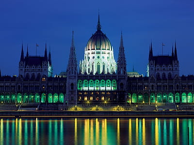 gray cathedral near body of water during night time thumbnail