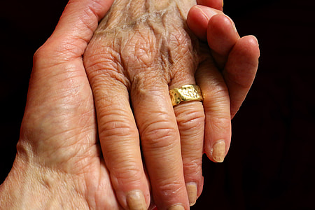person holding person's hand thumbnail