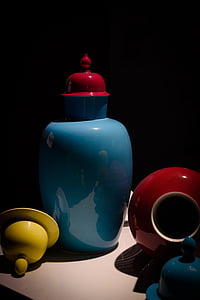blue ceramic jar with red cover on white surface thumbnail