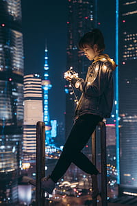 woman holding yellow string lights thumbnail