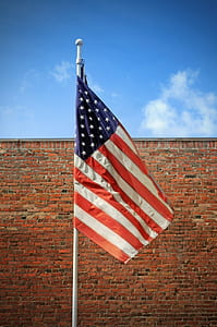 USA flag waving during daytime thumbnail