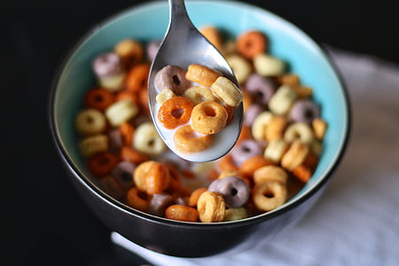 multicolored cereal with milk place on round black ceramic bowl thumbnail