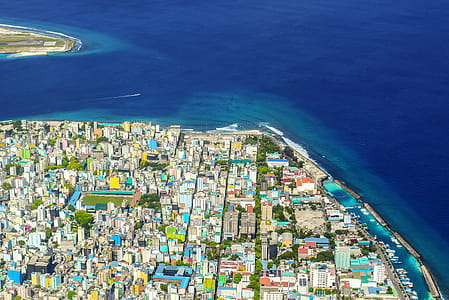 Bird's Eye View Photography of Buildings Near Body of Water thumbnail