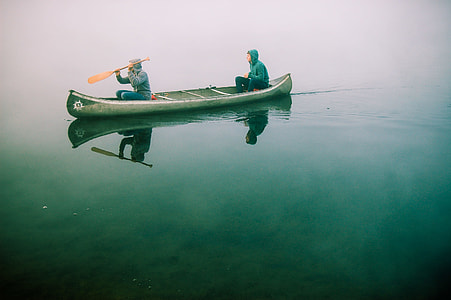 two men riding on boat thumbnail