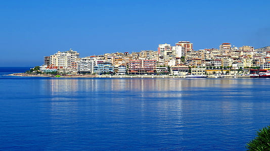 landscape photo of city buildings near on the body of water thumbnail