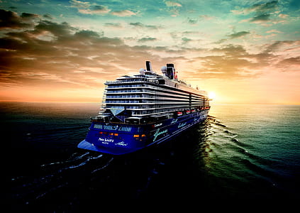white and blue cruise ship on body of water thumbnail