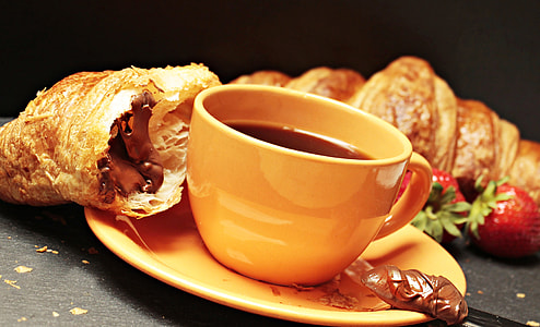 yellow ceramic cup on saucer thumbnail