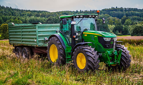 selective focus photography of green tractor thumbnail