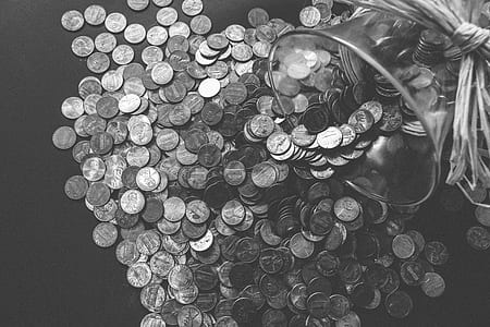 round silver-colored coin lot beside clear glass jar thumbnail
