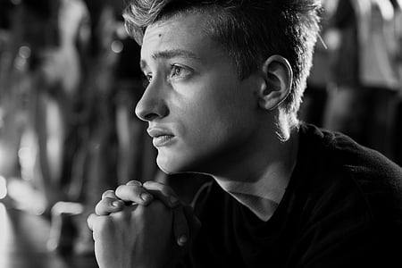 grayscale photography of man wearing crew-neck top thumbnail