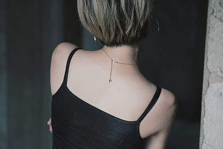 woman wearing black spaghetti strap top thumbnail