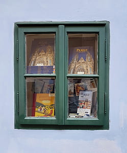 four books in display cabinet thumbnail
