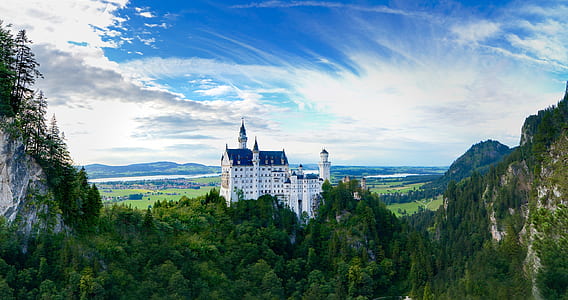 white and blue castle on hill at daytime thumbnail