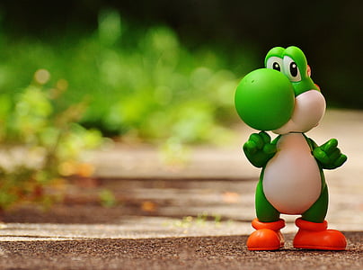 shallow focus photography of Yoshi model figure thumbnail