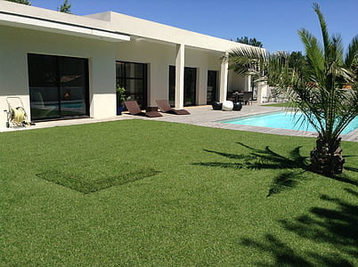 white house with pool on the side during daytime thumbnail