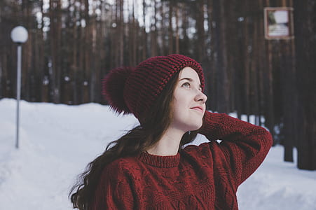 woman wearing red bobble hat thumbnail