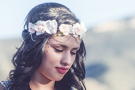 closeup photo of woman with white flower headband thumbnail