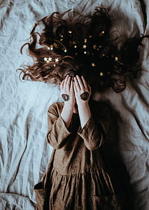 woman laying on bed thumbnail