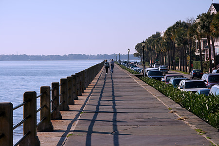 concrete pavement near body of water thumbnail