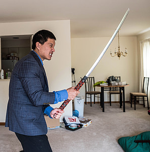 Asian man in suit about to slay an enemy thumbnail