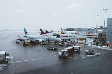 photo of airport under cloudy sky at daytime thumbnail