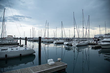 white boat lot on body of water thumbnail
