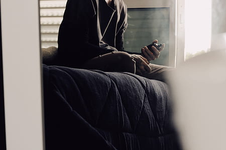person sitting on bed thumbnail