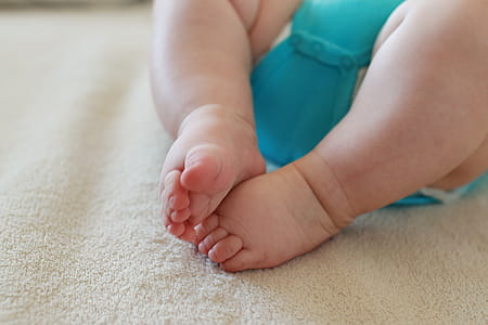 The newborn and his little feet on a blanket thumbnail