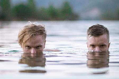 two men on body of water thumbnail