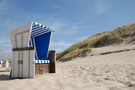 white wicker sofa on beach thumbnail