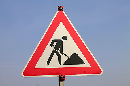 man working ahead road signage thumbnail