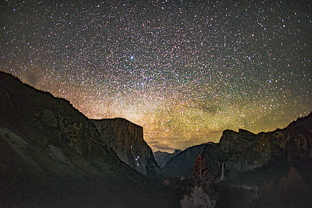 mountains below sky full of stars thumbnail
