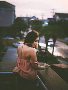 woman standing near wooden fence thumbnail