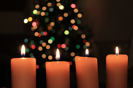 closeup photo of four orange lighted candles thumbnail