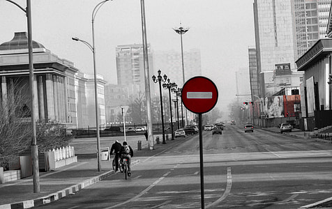 selective color photography of street with road sign thumbnail