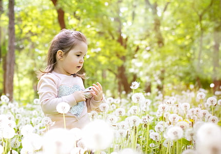 girl wearing white and beige top during daytime thumbnail
