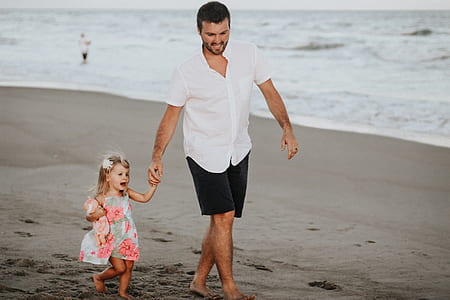 man holding her daughters hand thumbnail