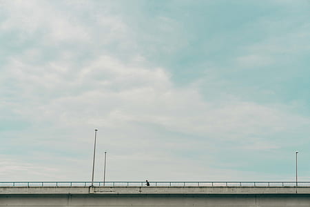 person walking on bridge thumbnail