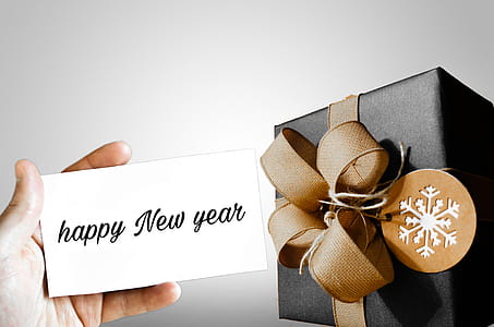 A gift for the new year - hand holding a card with package thumbnail