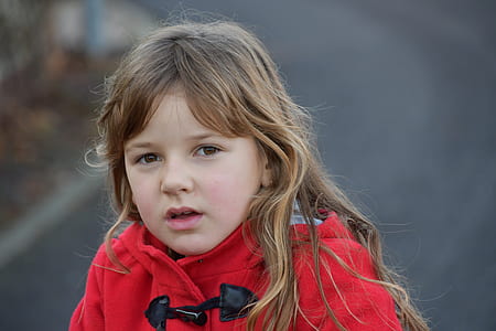 Blonde Girl Wearing Red Toggle Jacket thumbnail