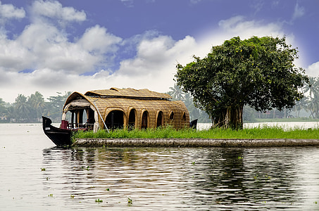 brown boat docked near island thumbnail