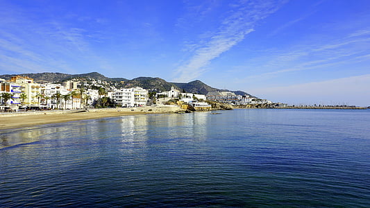 commercial buildings near blue ocean water thumbnail