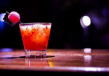 closeup photo of shot glass with orange liquid thumbnail
