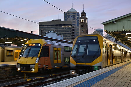 two yellow bullet train in rails thumbnail