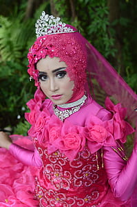 Woman Wears Pink Long-sleeved Dress With Crown thumbnail