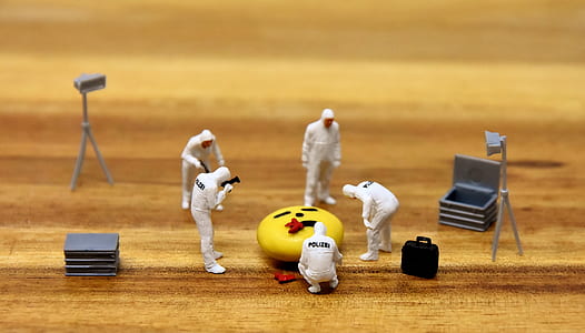 depth of field photography of astronauts figurines thumbnail