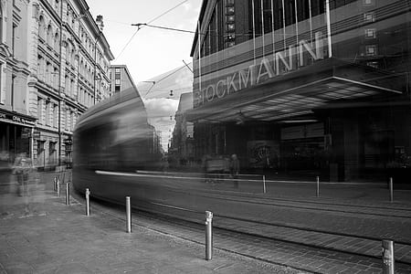 time-lapse photography of vehicles near buildings thumbnail