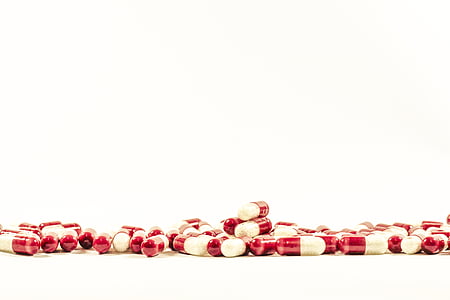 medication pill lot on white surface thumbnail