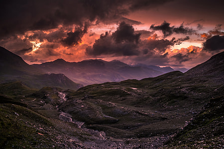 Rolling hills and mountains in Austria at sunset thumbnail
