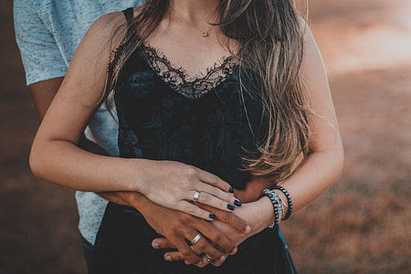 close up photography of couple holding each other thumbnail